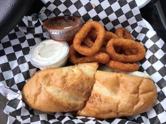 Trip tip sandwich combo with onion rings.