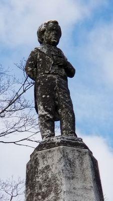 Life sized statue of Charles Stratton atop his monument