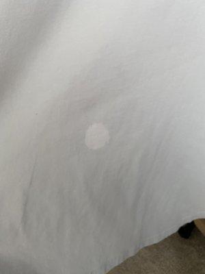 Bleach stain that ruined the shirt and the cleaners did not want to compensate for the damage they did!