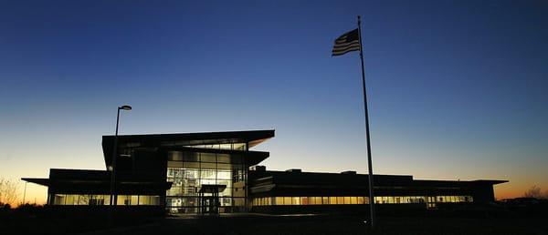 An evening shot of the new 54,000-square-foot printing and distribution facility, where Bliss Communications, Inc., prints th...