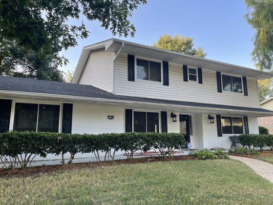 Black roof with white ascend siding