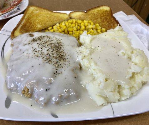 Chicken fried steak with sides of corn and mashed potatoes.  Was great!