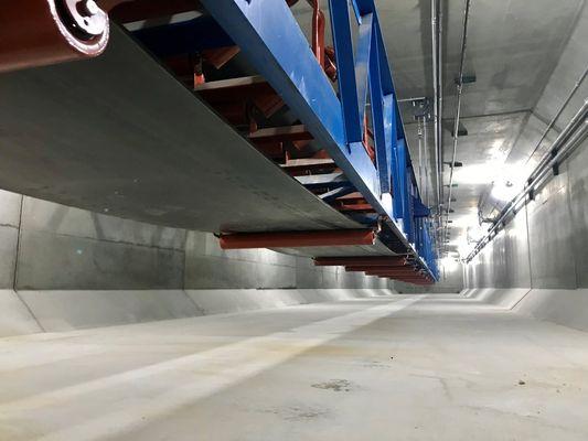 Aggregate conveyor belt at Wieser Concrete housed in box culverts made by Wieser Concrete