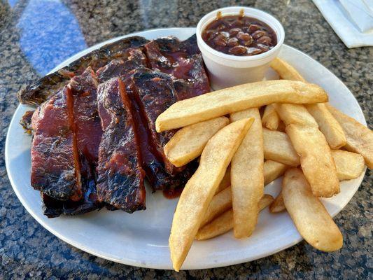 The Rib Dinner with fries and barbecue beans.