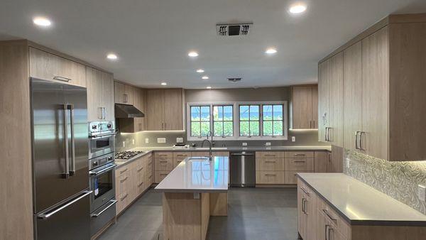 Beautiful light wood modern cabinets complete the update of this 1950's Encino home.