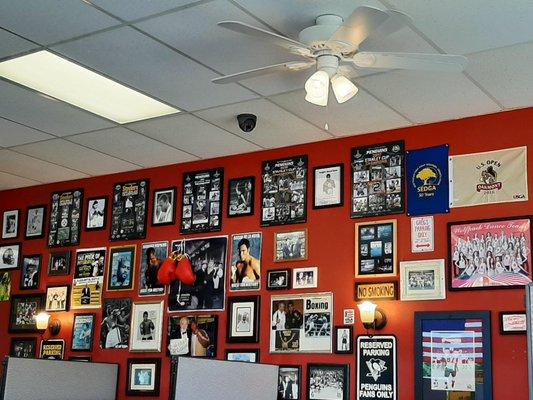 Inside. Wall of sports photos. Many are autographed. The former owner is in a lot of them, too.