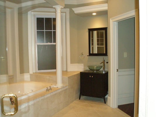 This Charming master bathroom renovation is second to none. Jacuzzi tub shadowed by a beautiful hand crafted canopy with colu...