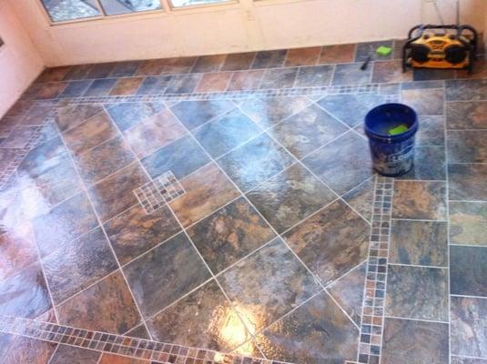 This is the lowes brand  porcelain slate tile look.  Multiple tile pattern design starting @ $19.90 per square foot.