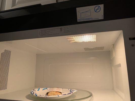 I'm almost certain those are dead roaches inside the microwave light. I'm too scared and grossed out to open it to find out for sure.