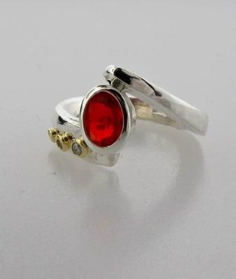 Custom hand forged sterling ring with 14k accents, diamonds, and Mexican fire opal