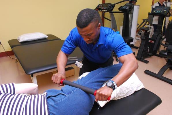 Physical Therapist working with patient