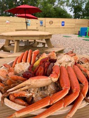 COME TRY OUR MONSTROUS DELUXE BOILED SEAFOOD PLATTER FOR $44.99. IT COMES WITH A POUND EACH OF SNOW CRABS, BLUE CRABS, SHRIMP, AND CRAWFISH!