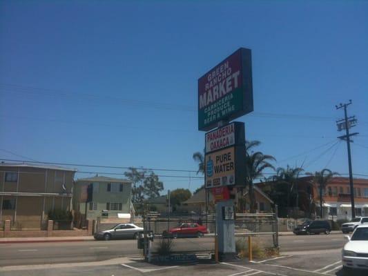 Street sign in parking shared with other businesses