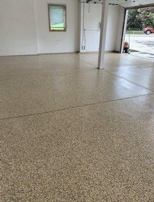 Beautiful copper mountain flake epoxy garage floor in Windsor, CO