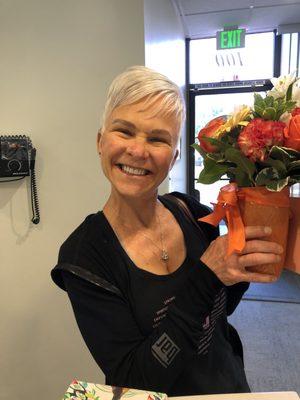 Super cheesy smile and watery eyes with my new veneers and beautiful flowers