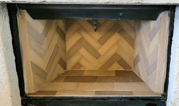 Herringbone pattern using 3 different colors of firebrick. notice the attention to detail in matching the grout lines in the corners!