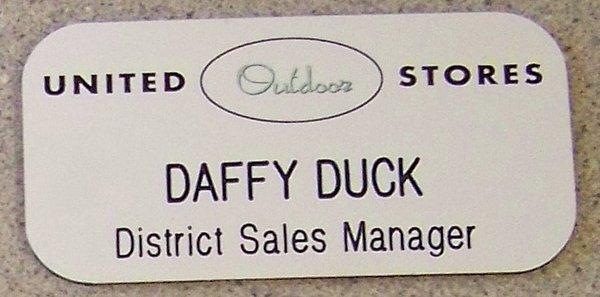 Silk screen printed two color name badge. Engraved for Daffy Duck :)