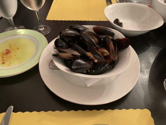 Large bowl of beautiful mussels in a white wine/garlic sauce.