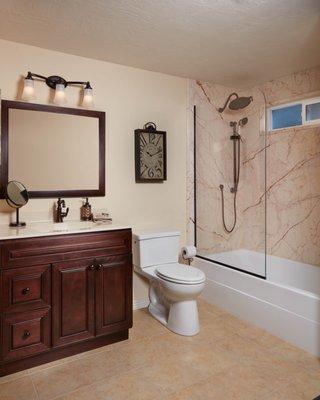 Full Bathroom Remodel with Sofitel Gold Marble Walls and a Shower Panel instead of doors