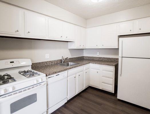 Coppertree Apartments upgraded kitchen with white appliances