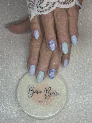 Easter vibes fiber gel overlay on natural nail with marble nails and abstract art