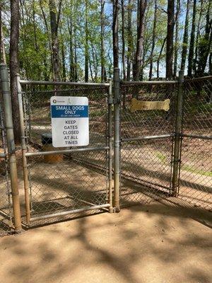 Entrance to small dog park plus a place to keep your leash