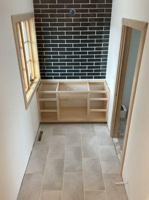 More subway tile and flooring installation