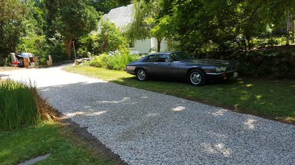 The only thing more eye-catching than this tight crushed stone job is the homeowners vintage Jaguar. Take a look!