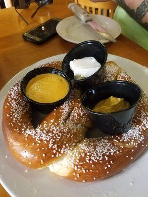 Pretzel  with beer cheese, cream cheese and mustard.