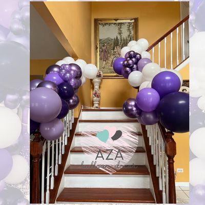 Organic balloon garlands make a great addition to any staircase.