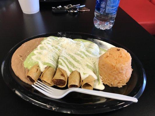 Potato flautas, traditional style with guacamole sauce, sour cream, and cheese. Served with rice and beans.