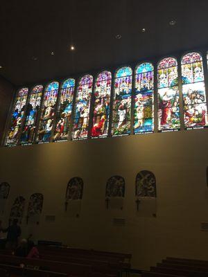 gorgeous stained glass above the stations of the cross