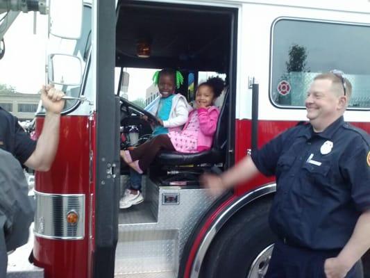 Kevi & Serenity enjoying Speedway Fire Truck!