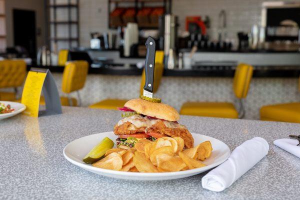 Fried chicken sandwich with chips