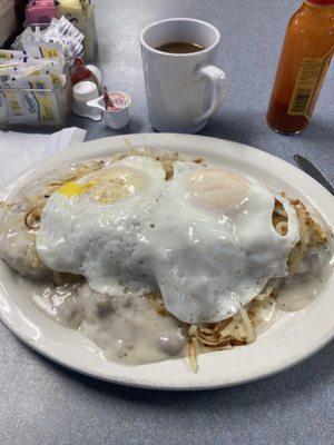 Three full biscuits, sausage gravy, hash browns, and eggs.