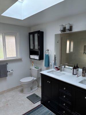 Upstairs bathroom included installation of a new vanity and mirror.