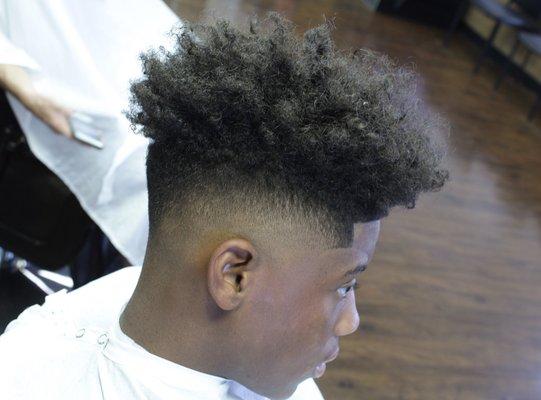 Mid Fade with curly top.. Root Fade