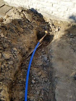 Replaced a water line from the meter to the house.