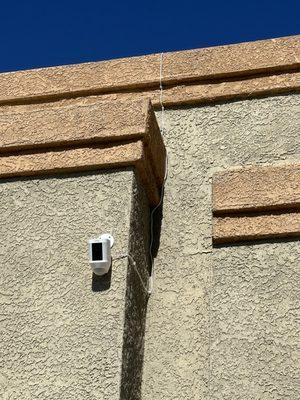 Ring Spotlight Camera installed w/ cable hidden and solar panel installed on the roof.