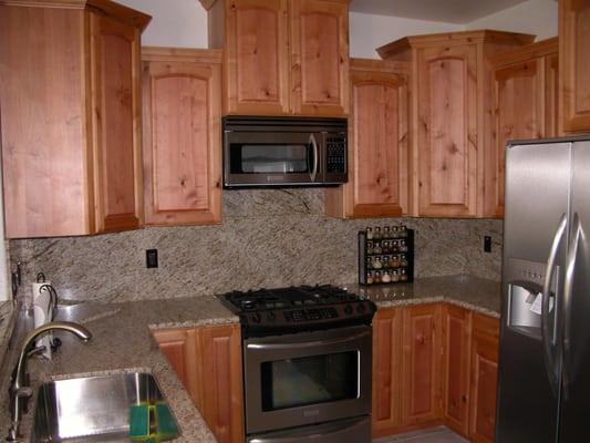 Knotty Alder natural finish, quality cabinets. stainless steel fixture