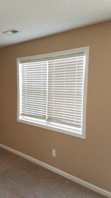 Faux wood blinds in select apartments