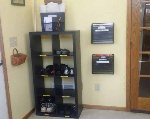 An entryway clearly labeled so the kids remember where to put their bags, shoes, and papers.