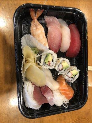 Sushi and sashimi combo for lunch.