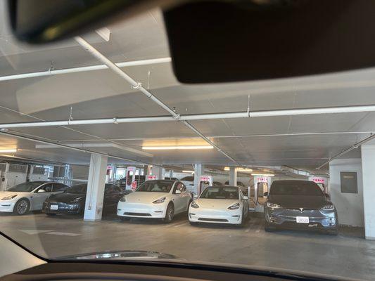 Tesla charging stations. Floor two of parking garage.