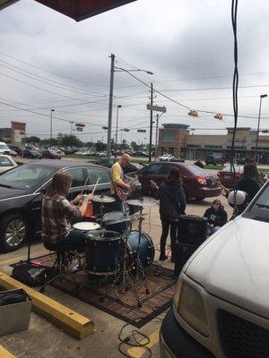 Burning Pages band played in parking lot for Rex Manning Day.