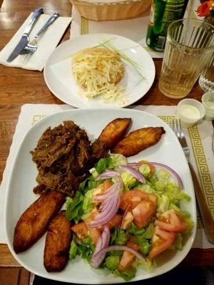 Pabellon Criollo - shredded beef, plantains, and salad (substitute for rice and beans). Sifrina arepa - chicken avocado salad and cheese