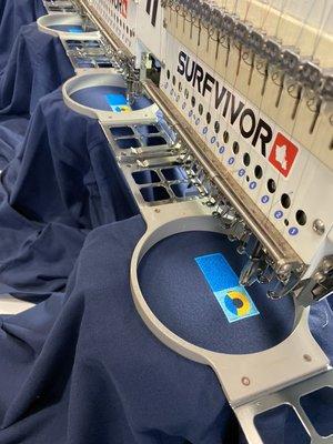 Daily production at Surfvivor. Have something motivated want embroidered? Call us, we can help.