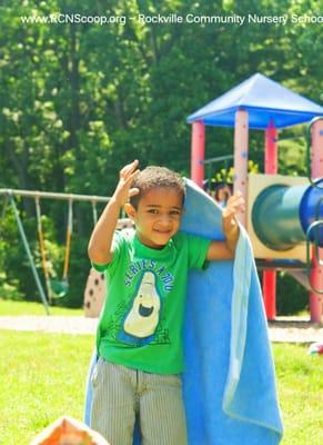 "Boo!" Outdoor play on the beautiful playground at our cooperative nursery school.