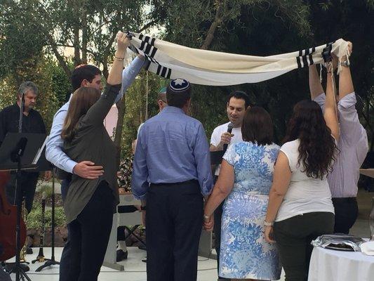 Rabbi Zylberman giving an anniversary blessing during a Shabbat service in our Warsaw Amphitheater