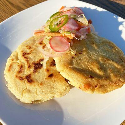 Pupusas made of Corn Masa stuffed with Lentil Chorizo and Cheese served with Curtido Pickles